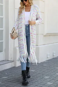 Detail shot of the long knit cardigan featuring a vibrant checkered pattern and fringe