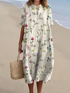 Casual midi-jurk voor dames met bloemenprint en Peter Pan-kraag in een zonnige strandsetting