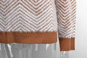 Close-up of women's fuzzy chevron knit sweater showing shaggy texture and ribbed hem