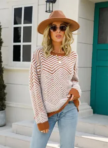Close-up of women's brown and white chevron knit sweater with a soft plush texture