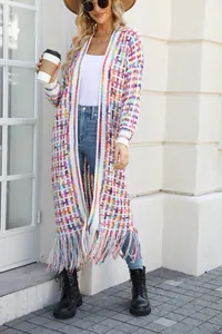 Detailed view of the long knitted cardigan featuring vibrant colorful weave and fringe hem.