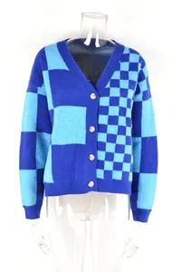 Detailed view of women's blue checkerboard patchwork knit cardigan with buttons