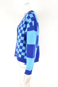 Side view detail of a blue and light blue checkered knitted cardigan on a mannequin