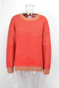 Red and orange chevron knit sweater with a soft fuzzy mohair-like texture close-up view.