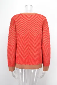 Back view of red and brown chevron pattern long sleeve knit sweater on mannequin