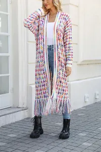 Detail of long knitted cardigan with colorful weave and fringe hem