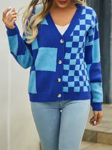 Detailed view of women's checkerboard patchwork knit cardigan sweater in vibrant blue