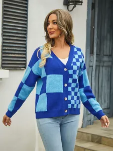 Detailed view of women's blue checkered knitted cardigan sweater coat with buttons