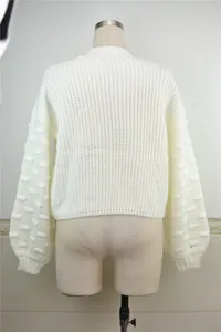 Back view of a minimalist white chunky knit cropped sweater with textured bubble sleeves