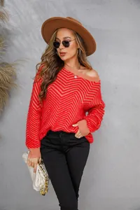 Detail shot of woman in red chevron fluffy knit sweater with brown wide-brimmed hat