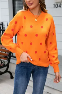 Orange crew neck sweater with red polka dots for casual women's knitwear style