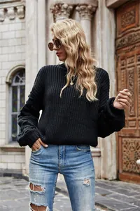 Stylish black chunky knit sweater featuring lantern sleeves and a cropped waist length