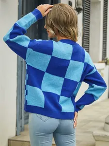 Detailed back view of women's oversized blue checkerboard knit sweater in casual style