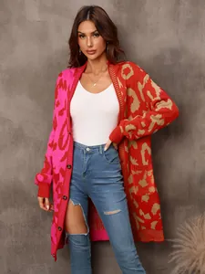 Detail of woman in long leopard print spliced cardigan with bold red and pink colors.