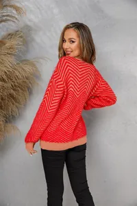 Detail showing the red chevron fuzzy knit texture of this women's crew neck sweater