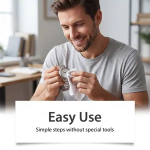 Demonstration of using a soft cloth to clean a silver metal watch for easy daily maintenance.