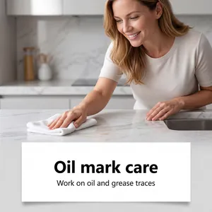 Detailed view of cleaner spray effectively removing oil marks from marble countertop