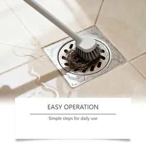 Action shot of long-handle drain cleaning brush removing hair from shower drain