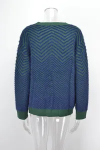 Back view of fuzzy green and blue chevron knit sweater with ribbed cuffs and hem.