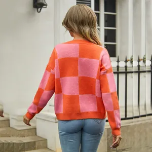 Stylish pink and orange checkerboard pattern oversized knit sweater for women back view