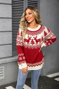 Detailed view of a festive red and white Christmas sweater featuring reindeer jacquard patterns