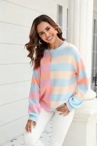 Close-up shot of a vibrant color-block striped knit sweater featuring soft pastel tones.
