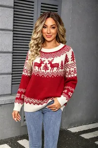 Detailed view of red Christmas knit sweater with reindeer and snowflake jacquard.