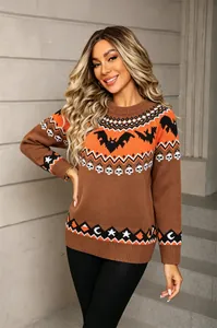 Detailed view of women's Halloween knit sweater featuring orange bat and skull patterns