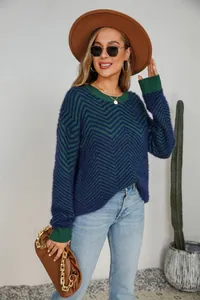 Detailed lifestyle view of women's long sleeve crew neck sweater in navy and green chevron knit