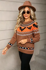 Detail view of brown Halloween knit sweater with orange bat and skull patterns for women