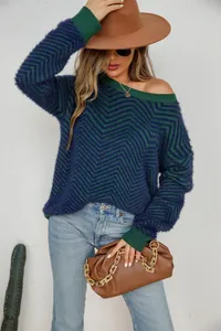 Detail view of women's blue and green chevron knit sweater with soft fuzzy texture