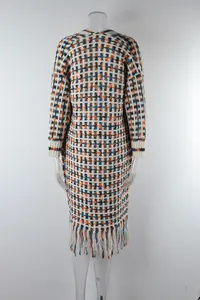 Detailed back view of a long colorful checkered knit cardigan with stylish tassel hem