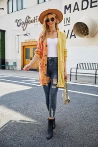 Model wearing vibrant leopard print long cardigan in yellow and pink gradient