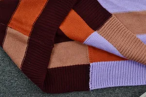 Detailed close-up showing the soft fabric texture of a patchwork color block knit sweater