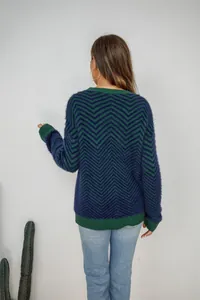 Back view of women's long-sleeve knit sweater with green and navy chevron pattern