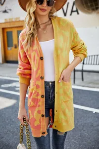 Full-length view of a vibrant leopard print gradient knit cardigan with large buttons.