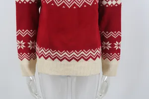 Close-up of vintage red Christmas sweater with white snowflake jacquard patterns