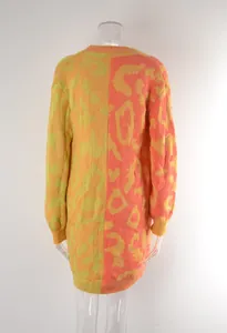 Back view of a vibrant leopard print split knit longline sweater on a mannequin.