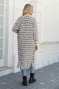 Back view detail of a long-line knitted cardigan with colorful checkered pattern and fringe