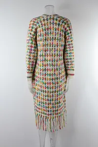 Detailed back view of a colorful checkered knit long cardigan with fringe hem