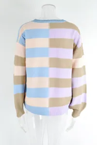 Back view showing the split vertical design of a color-block striped knit sweater.