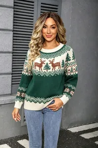Full front detail of a vintage knit Christmas sweater with reindeer and tree motifs.