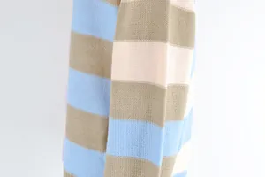 Close-up of the textured knit fabric showing blue, pink, and khaki horizontal stripes.