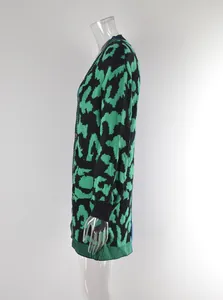 Side view of mid-length green leopard print cardigan with blue accent panel detail