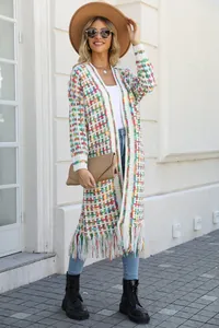 Bohemian style colorful long knit cardigan with fringe detailing worn by a model
