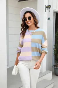 Woman wearing a stylish color-block striped crewneck knit pullover sweater for spring