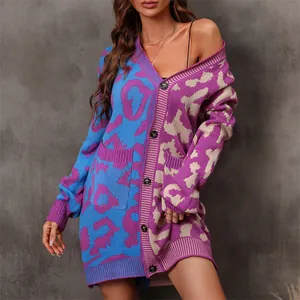 Detail view of stylish leopard patchwork knit cardigan with large buttons and front pockets.