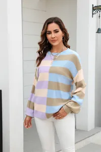 Detailed texture of a colorful block striped crewneck knit sweater on a model.