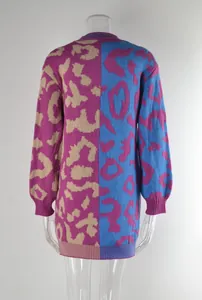 Close-up detail of a vibrant leopard print color block knit sweater dress for women.