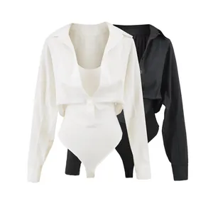 Detail view of stylish two-piece style shirt bodysuit in black and white ribbed fabric texture